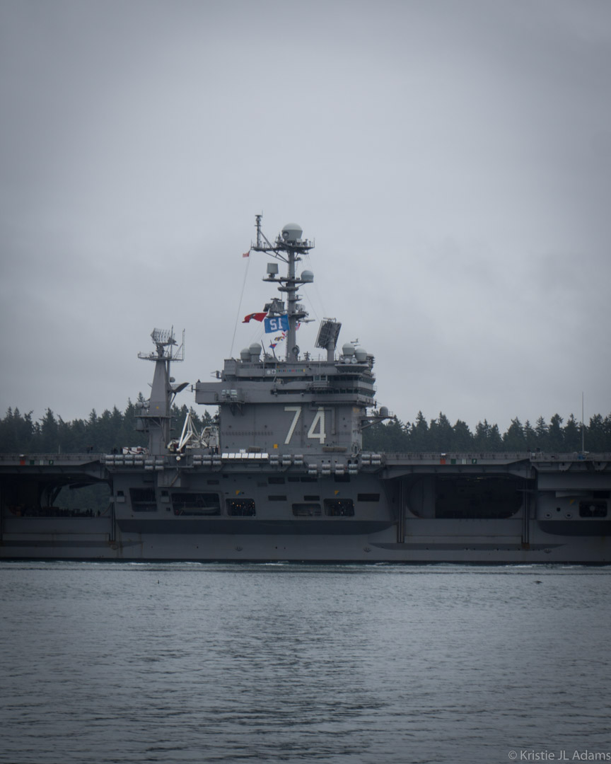 USS Stennis flying the 12th Man flag while departing January 2016